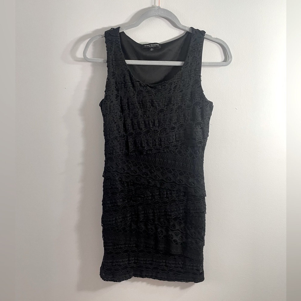 Green envelope black dress